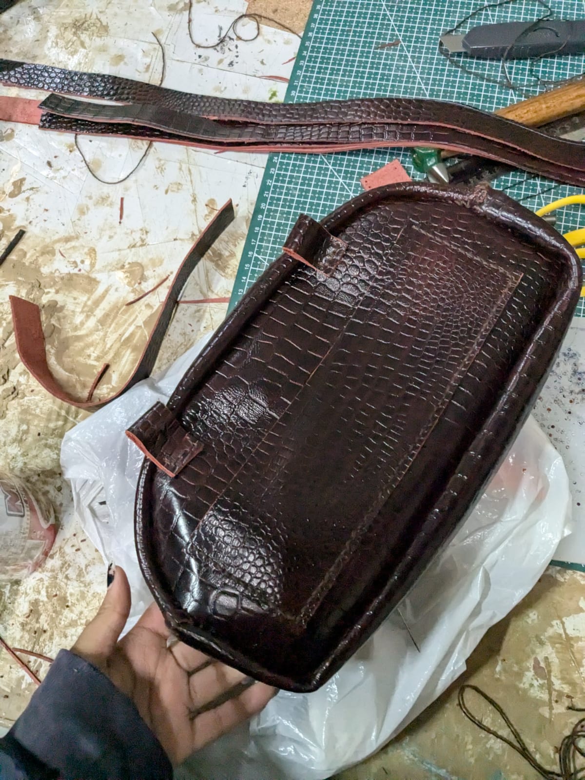 Top-down view of the leather purse showing the opening, zipper line, and construction depth